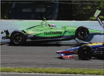  ?? GREG HUEY / AP ?? Danica Patrick hits the wall after losing traction during Lap 68 of what is expected to be her final career race. Patrick placed 30th, her worst finish in eight appearance­s in “The Greatest Spectacle in Racing.”