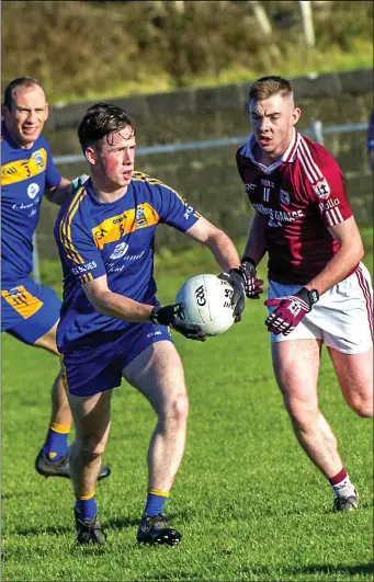  ??  ?? Easkey’s Rory McHugh) clears his lines as his opponent Sean Morrissey moves in to tackle. Pics: Tom Callanan.