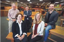  ?? MARK WEBER/THE COMMERCIAL APPEAL ?? Local investors (first row) Wilson Robbins and Christy Yarbro and (back row) John Vergos and Matthew Crow, along with chief operating officer for the landlord Cory Prewitt, will open a new bookstore in the same location as the now-closed Bookseller­s at...