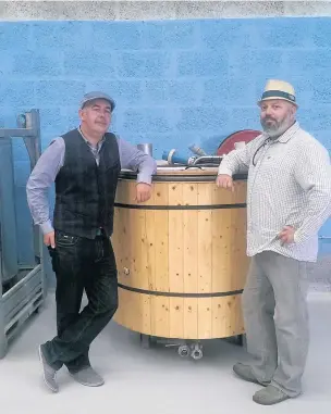  ??  ?? Businessma­n Neil Randle, left, and chef Craig Jackson, are preparing to open a micro brewery called Bang On Brewery on Bridgend Industrial Estate. They are pictured with the brew copper