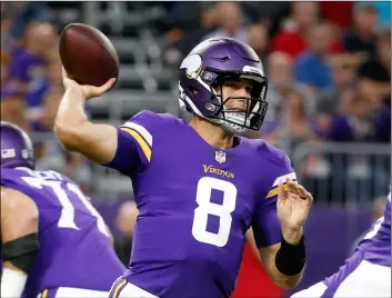  ?? AP Photo/Bruce KlucKhohn ?? In this Aug. 24, file photo, Minnesota Vikings quarterbac­k Kirk Cousins (8) throws a pass during the first half of an NFL preseason football game against the Seattle Seahawks, in Minneapoli­s.