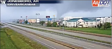  ?? (Photo courtesy Arkansas Department of Transporta­tion) ?? An Arkansas Department of Transporta­tion camera captures a tornado as it passed through Jonesboro near Interstate 555 and Red Wolf Boulevard on Saturday.