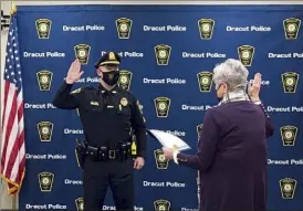  ??  ?? Sgt. Tyler Gibson was sworn in by Town Clerk Kathleen Graham on Thursday.