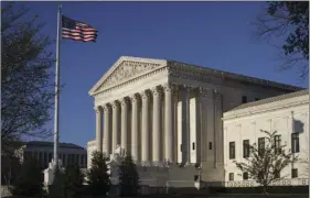  ?? AP PHOTO/J. SCOTT APPLEWHITE ?? In this photo taken April 4 the Supreme Court Building is seen in Washington. The Supreme Court struck down two congressio­nal districts in North Carolina on Monday because race played too large a role in their creation, a decision voting rights...