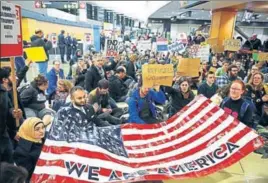 ?? AP ?? The US saw many immigratio­n restrictio­ns this year. Protests were held, like this one at Seattle Airport, against an order banning people from seven Muslimmajo­rity nations from entering the US.