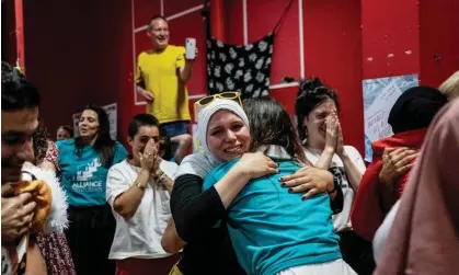  ?? Photograph: Jeff Pachoud/AFP/Getty Images ?? Members of the pro-burkini associatio­n Alliance Citoyenne celebratin­g after the council voted to allow burkinis in Grenoble swimming pools – a decision that has since been overruled.