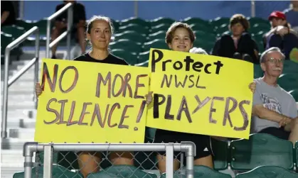  ?? Photograph: Andy Mead/ISI Photos/Getty Images ?? Fans hold up signs reading ‘No More Silence!’ and ‘Protect NWSL Players’ before a game between Racing Louisville FC and North Carolina Courage at Sahlen's Stadium at WakeMed Soccer Park in Cary, North Carolina.