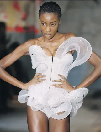  ?? PATRICK KOVARIK/AFP/GETTY IMAGES ?? A model presents a creation by Serkan Cura during the 2015 Haute Couture Spring-Summer collection fashion show in January in Paris.