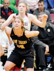  ?? ANNETTE BEARD PEA RIDGE TIMES ?? Prairie Grove sophomore Abby Preston boxes out junior Lady Blackhawk Josey Goldberg (No. 2) during the Colors Day contest Friday, Feb. 7, in Pea Ridge. Pea Ridge defeated the Lady Tigers, 41-37.