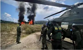  ?? Photograph: Richard Ladkani/Malaika Pictures ?? Operation Xapiri agents stand back from a fire in the Tapajós basin of the Amazon rainforest.