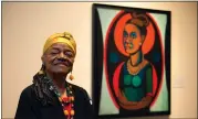  ?? JACQUELYN MARTIN – THE ASSOCIATED PRESS ?? Artist Faith Ringgold poses for a portrait in front of a painted self-portrait during a press preview of her exhibition, “American People, Black Light: Faith Ringgold’s Paintings of the 1960s” at the National Museum of Women in the Arts in Washington, June 19, 2013.