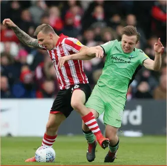  ??  ?? Hussle and tussle. Colchester’s Tom Lapslie (right) and lincoln city’s harry anderson scrap for the ball. Lapslie was the hero in his team’s victory over spurs recently and he could play a big part in his team’s league two encounter against crawley town on saturday.