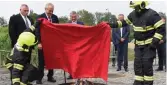  ??  ?? Milos Zeman ( third from left) burning a huge undergarme­nt during a press conference.