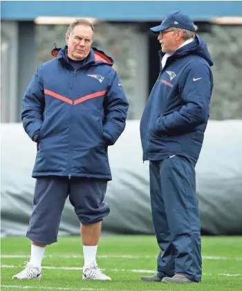  ?? ASSOCIATED PRESS ?? Patriots coach Bill Belichick speaks with football research director Ernie Adams. Adams helped change a play-call that was key in the Patriots’ defeat of the Rams in the 36th Super Bowl. He remains a trusted adviser to Belichick.