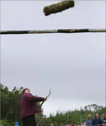  ?? .Photo:Valerie O’Sullivan ?? Michael O’Sullivan, Knocknagos­hel, tossing the sheaf, at the Annual Glencar Cattle Show & Carnival, Co Kerry on Sunday,