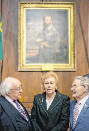  ?? PHOTO: GARETH CHANEY ?? Lest we forget: President Michael D Higgins and Holocaust survivors Suzi Diamond and Tomi Reichental at last year’s memorial event in the Mansion House, Dublin.