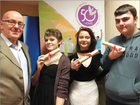  ??  ?? John Dunlea of CDYS pictured with Mallow award winners Kayleigh Somers, Leila Gresa and Keelen Aspell.