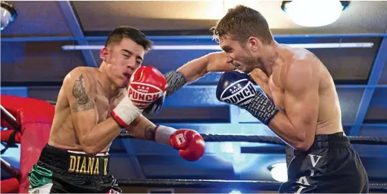  ?? Photo: Kevin Farmer ?? COP THAT: Steve Spark (right) and Ronaldo Castillo fighting for the IBF World Youth Super Lightweigh­t Championsh­ip at Rumours Internatio­nal in March.