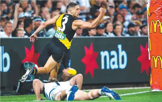  ??  ?? Richmond’s Dion Prestia celebrates a goal during the grand final against Geelong. Picture: Jono Searle