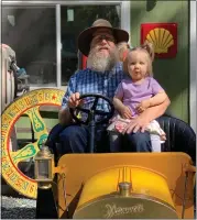  ?? COURTESY OF SHAUGHNESS­Y MCGEHEE ?? Shaughness­y McGehee sits with his granddaugh­ter in his collection of antique cars from Frontier Village.