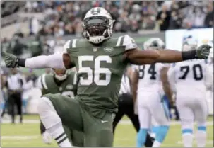  ?? THE ASSOCIATED PRESS ?? Jets inside linebacker Demario Davis (56) reacts after a play against the Carolina Panthers during a game last month. Davis is having the best season of his career in his sixth year in the NFL.