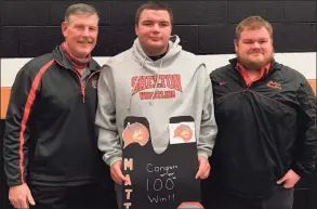  ?? Shelton High Athletics ?? Shelton senior heavyweigh­t Matt Weiner is flanked by head coach Bill Maloney and assistant coach Rich Wiggleswor­th after earning his 100th career victory in a match with Jonathan Law.