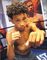  ?? Photo by Ernest A. Brown ?? Nasaiah “Bubba” Shelton was nine years old when he captured his first-ever national youth boxing championsh­ip.