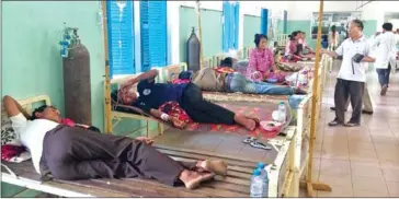  ?? SUPPLIED ?? Sick villagers are treated at the Kratie Provincial Referral Hospital after drinking suspected contaminat­ed water from a local stream.