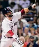  ?? Charles Krupa / Associated Press ?? Boston’s J.D. Martinez watches his RBI sacrifice fly during the fourth inning.