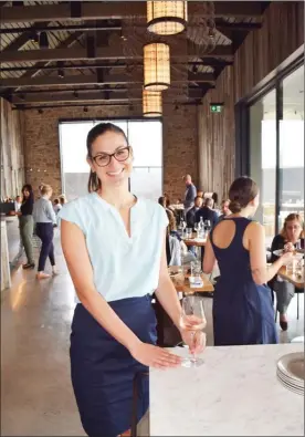  ?? STEVE MacNAULL/The Okanagan Weekend ?? Left: server Zoe Felsenhard­t will deliver you a glass of the CedarCreek 2018 Platinum Block 1 Rose at the new Home Block Restaurant at Kelowna’s CedarCreek Winery. Right: Mission Hill Family Estate’s first outdoor event of the season was last weekend’s Spring Farm-to-Table Lunch.