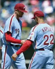  ?? DERIK HAMILTON — THE ASSOCIATED PRESS ?? Phillies starting pitcher Ben Lively, left, walks off the mound after he was pulled during the third inning by manager Gabe Kapler Thursday at Citizens Bank Park.