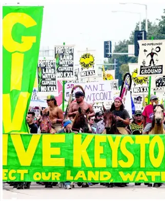  ??  ?? In this August 6, 2017 file photo, demonstrat­ors against the Keystone XL pipeline march in Lincoln, Nebraska. The Trump administra­tion is approving a right of way allowing the Keystone XL oil sands pipeline to be built across