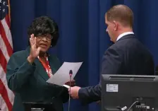  ?? ANGELA ROWLINGS PHOTOS / HERALD STAFF ?? CALL HER COUNCILOR: New City Councilor Althea Garrison is congratula­ted, left, by Eileen Kenner at City Hall on Wednesday. At right, Garrison is sworn in by Mayor Martin J. Walsh.