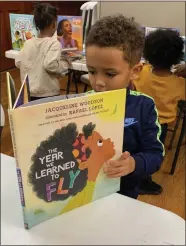  ?? SUBMITTED PHOTO ?? Pottstown children are enjoying books being given away by the NAACP that feature characters who look like them.