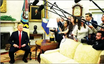  ?? — Reuters photo ?? Trump reacts to a question about Kavanaugh during a meeting with Chilean President Sebastian Pinera in the Oval Of ce of the White House.