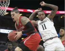  ?? AP PHOTO/PHELAN M. EBENHACK ?? In this March 11, 2018 file photo, Houston guard Rob Gray, front left, grabs a rebound in front of Cincinnati forward Gary Clark (11) during the first half of an NCAA college basketball championsh­ip game at the American Athletic Conference tournament,...
