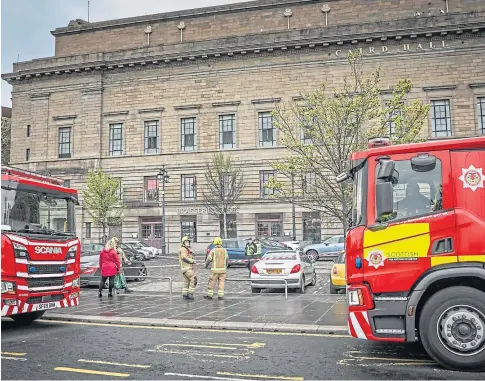  ??  ?? SAFETY: Fire crews on the scene at the Slessor Gardens side of the Caird Hall during last month’s gas leak incident. Picture by Mhairi Edwards.