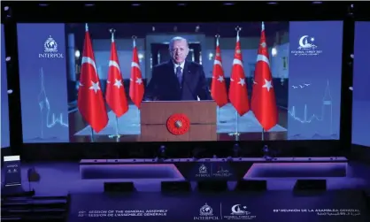  ?? Photograph: Anadolu Agency/Getty Images ?? The Turkish president, Recep Tayyip Erdoğan, addresses the opening session of the 89th Interpol general assembly in Istanbul, 23 November 2021.