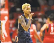  ?? Nick Wass / Associated Press ?? Connecticu­t Sun guard Courtney Williams gestures after she made a basket in the second half of Game 2 of the WNBA Finals against the Washington Mystics on Tuesday.