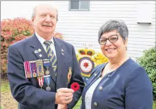  ?? CARLA ALLEN ?? Kevin Gates, vice-president of Royal Canadian Legion branch 61, prepares to pin a poppy on Yarmouth Mayor Pam Mood to launch the annual poppy campaign on Oct. 26.