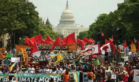  ?? ASTRID RIECKEN/GETTY IMAGES ?? People march from the U.S. Capitol to the White House for the People’s Climate Movement to protest President Donald Trump’s environmen­tal policies.