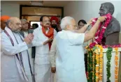  ?? PM Narendra Modi pays tribute to Pandit Deen Dayal Upadhyay in New Delhi. — PRITAM BANDYOPADH­YAY ??