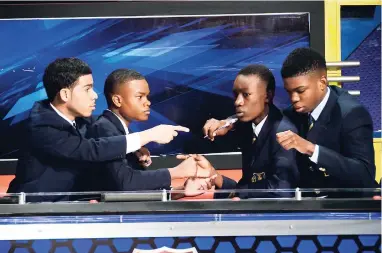  ??  ?? Defending champions Munro College during their match against St Jago High. From left: Team captain Brandon Larmond, Kirkland Webb, Renaldino Henry and Delano Mullings.