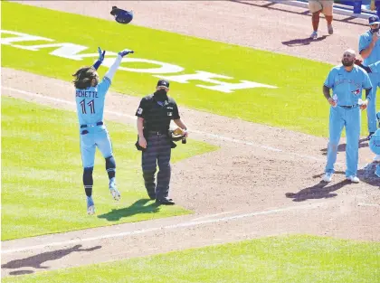  ?? JULIO AGUILAR/GETTY IMAGES ?? Bo Bichette tosses his helmet after hitting a walk-off homer in the ninth inning to give the Blue Jays a 5-4 win over the New York Yankees at TD Ballpark in Dunedin, Fla., on Wednesday. It was the second homer of the game for Bichette, who has an 11-game hitting streak.