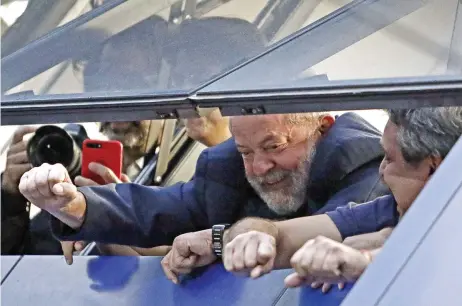  ?? (AFP) ?? Brazil’s former president Luiz Inácio Lula da Silva waves to supporters in Sao Bernardo do Campo on Friday