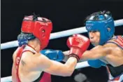  ?? AFP ?? German Nadine Apetz (L) fights with Lovlina Borgohain.