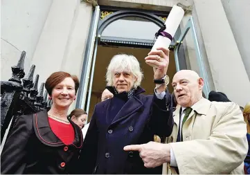  ??  ?? Bob Geldof arrives to return his ‘Freedom of the City of Dublin’ with local councillor Mannix Flynn and Oonagh Casey of Dublin’s City Manager’s office, after saying he could not continue to hold the honour with Myanmar leader Aung San Suu Kyi, in...