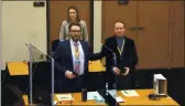  ?? COURT TV ?? In this screen grab from video, defense attorney Eric Nelson, left, defendant and former Minneapoli­s police officer Derek Chauvin, right, and Nelson’s assistant Amy Voss, back, introduce themselves to potential jurors at the Hennepin County Courthouse in Minneapoli­s, Minn.