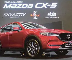  ?? PIC BY EIZAIRI SHAMSUDIN ?? MayBank IB has picked Bermaz Auto Bhd as its top ‘buy’ for its stronger growth potential, based on volume growth from the new CX-5 model and margin recovery from a stronger ringgit against yen.