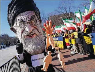  ?? Pablo Martinez Monsivais / Associated Press ?? A demonstrat­or dressed as Iranian Supreme Leader Ayatollah Ali Khamenei rallies across from the White House on Saturday in solidarity with anti-government demonstrat­ors in Iran.